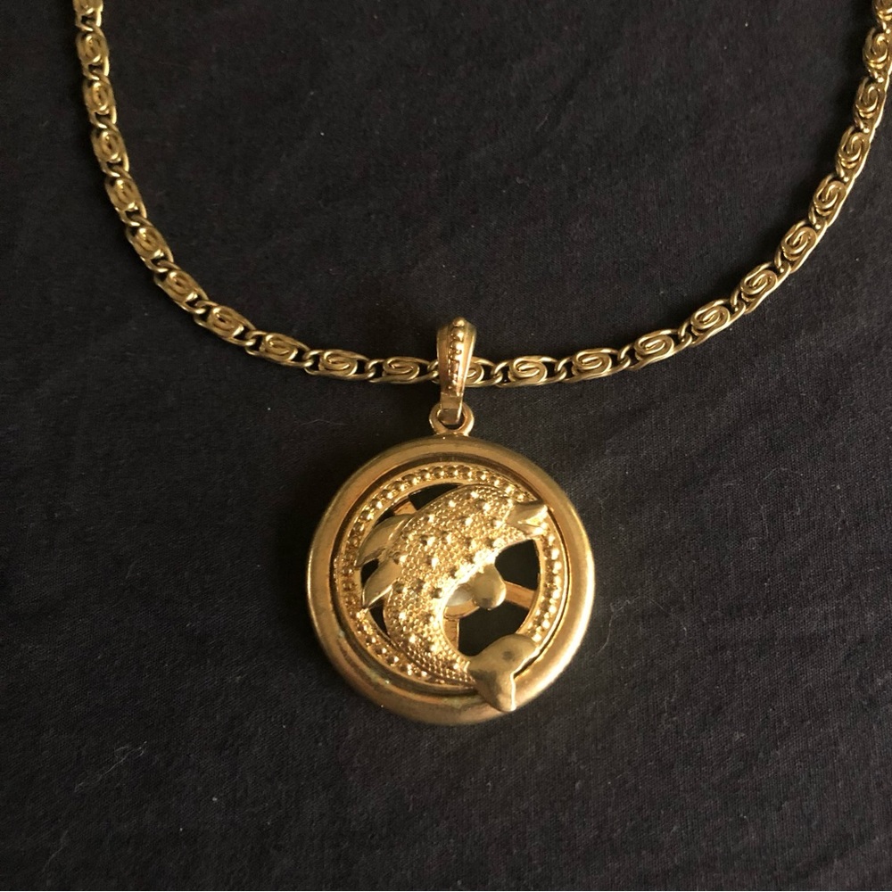 Vintage Gold tone spinning dolphin pendant with chain necklace